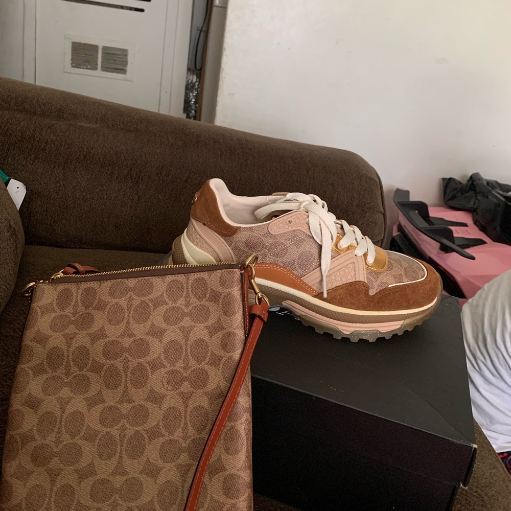 A coach crossbody purse with the shoes to match